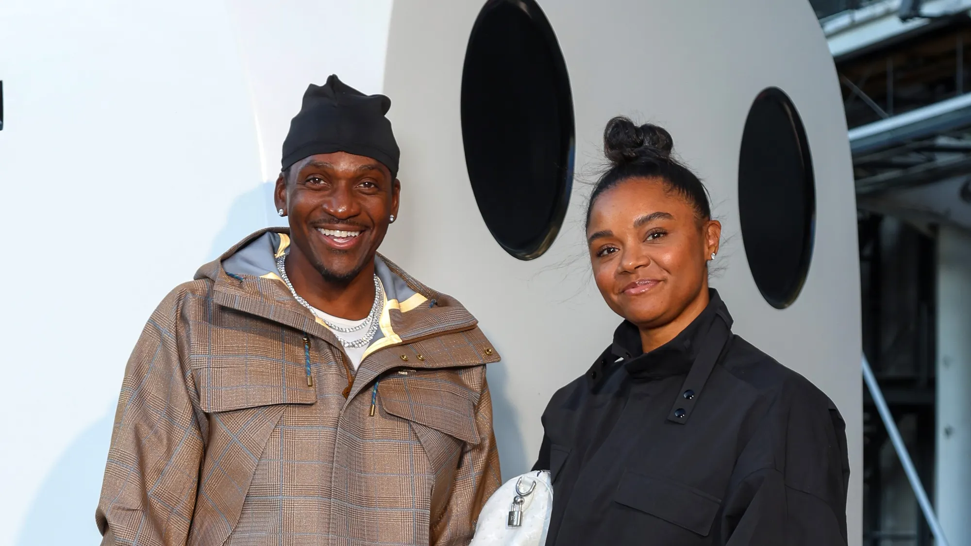 Pusha T, Virginia Williams ​and​ their son Nigel Brixx ‌Thorton attend the Louis vuitton Menswear Spring/Summer 2026 show as ⁢part of Paris Fashion Week