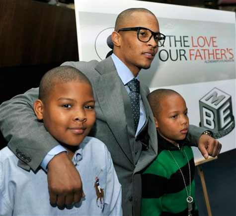 T.I. poses with his sons Messiah and Domani.