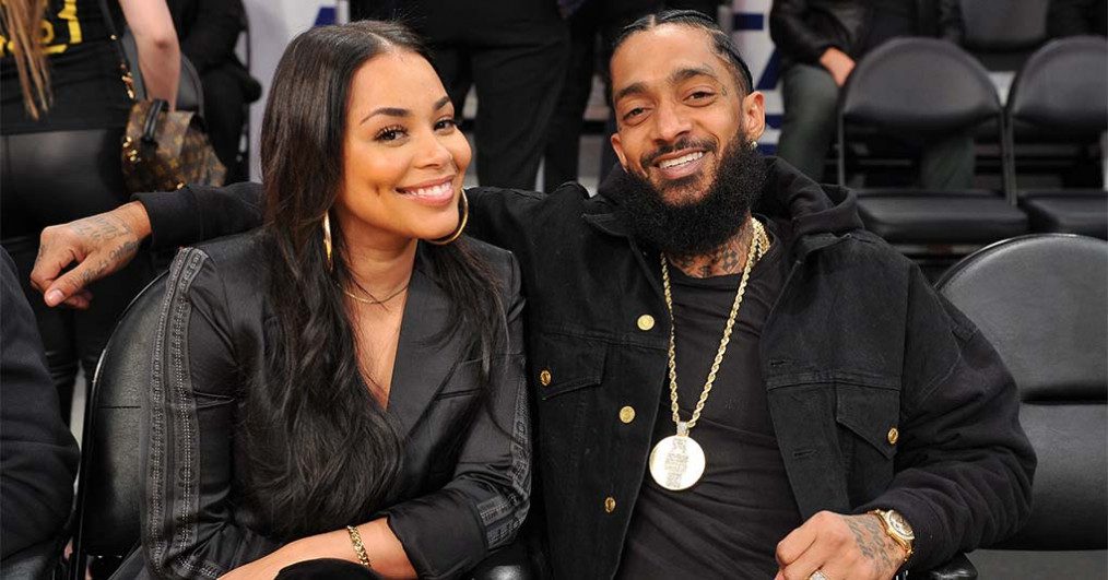 Lauren London and Nipsey Hussle attend a basketball game between the Los Angeles Lakers and the Portland Trail Blazers